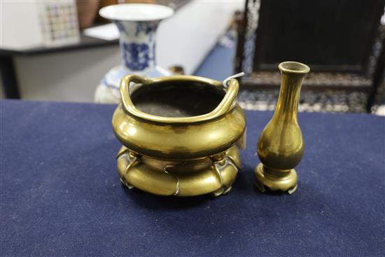 A Chinese polished bronze censer with stand and a similar bottle vase, 17th/18th century, censer 16cm diameter, vase 15.5cm high
